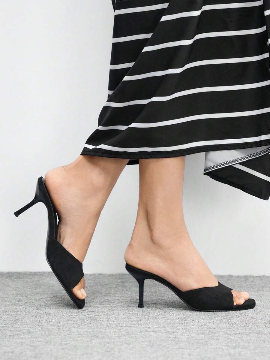 Women's black square toe high heel sandals featuring an open toe design, thin stiletto heel, and slingback strap.