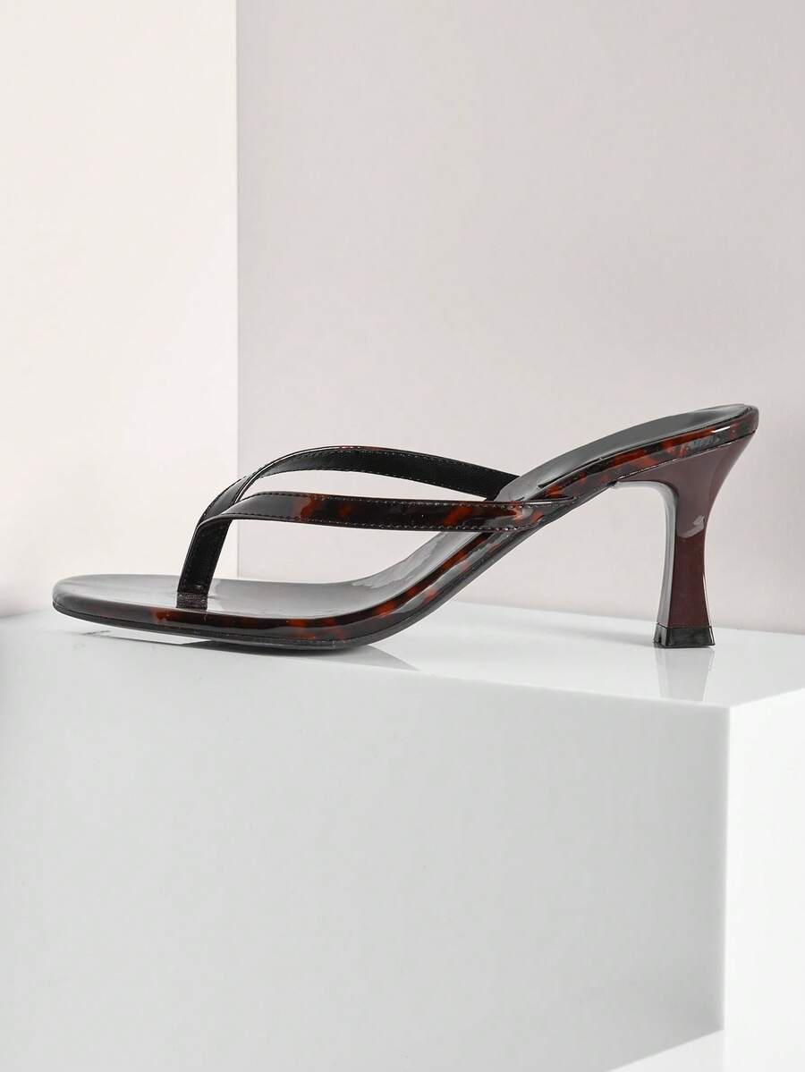 Women's minimalist black PU leather thong heel sandals featuring kitten heels and rhinestone accents