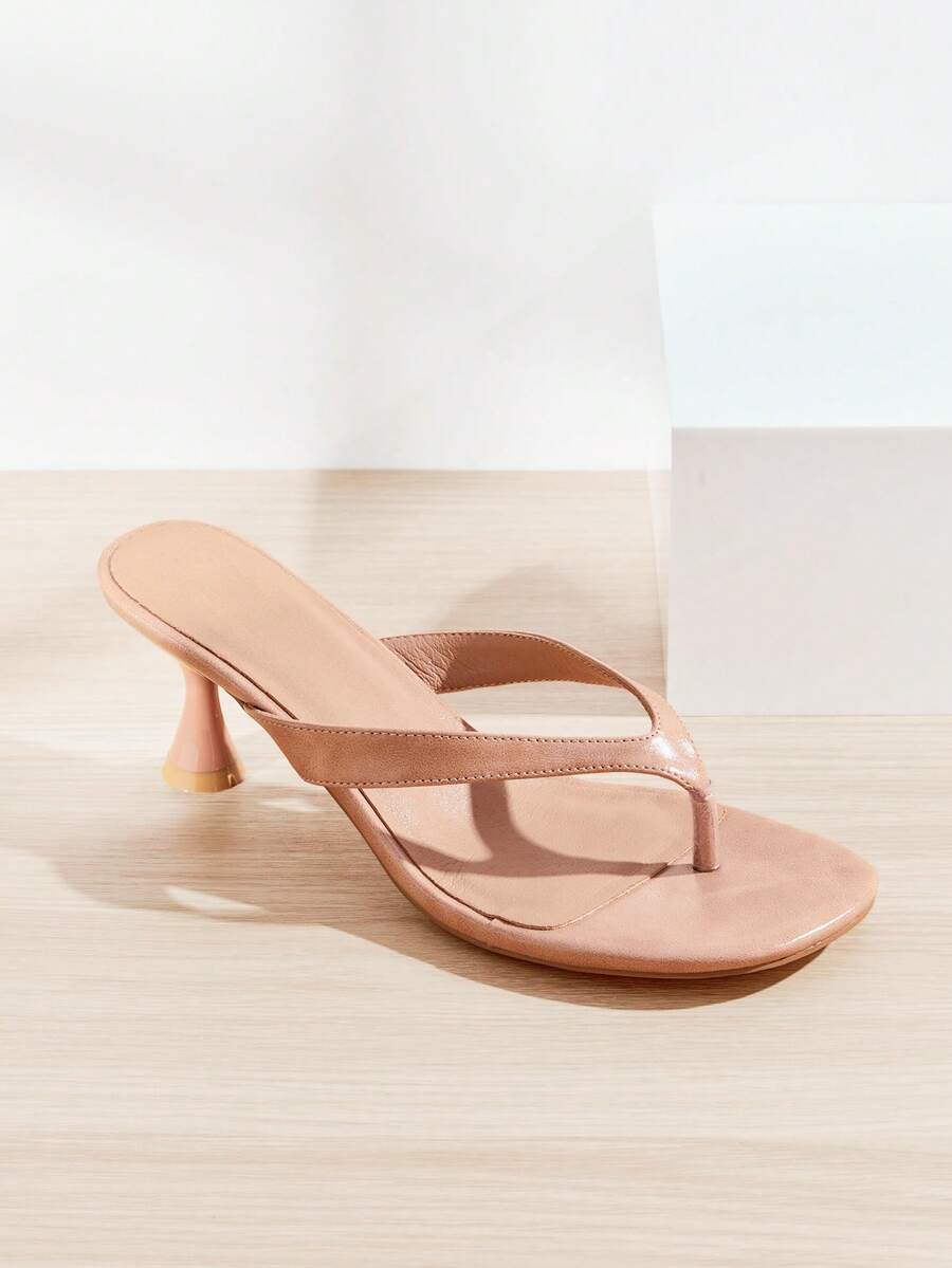 Women's minimalist black PU leather thong heel sandals featuring kitten heels and rhinestone accents