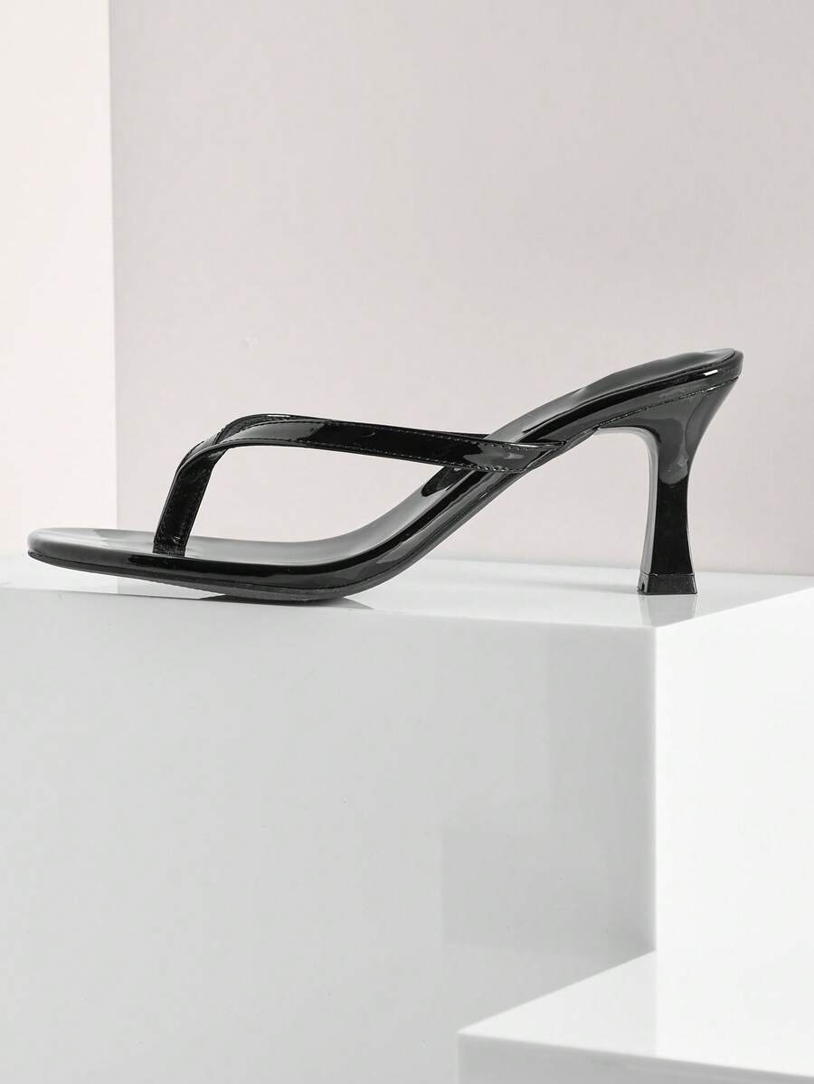 Women's minimalist black PU leather thong heel sandals featuring kitten heels and rhinestone accents