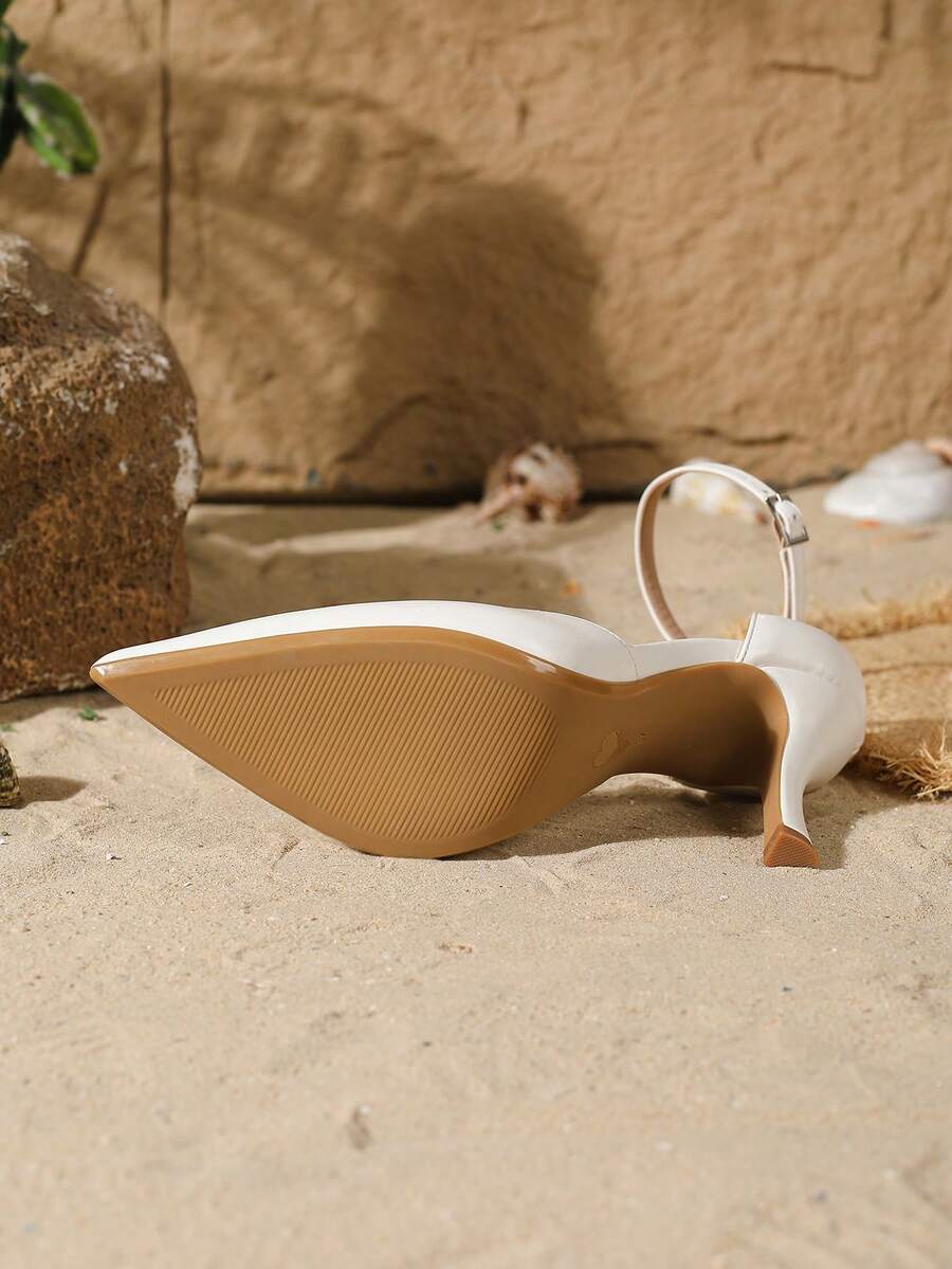 Elegant pointy-toe stiletto high heel pumps with hollow out sides and buckle ankle strap for weddings and evening dresses.