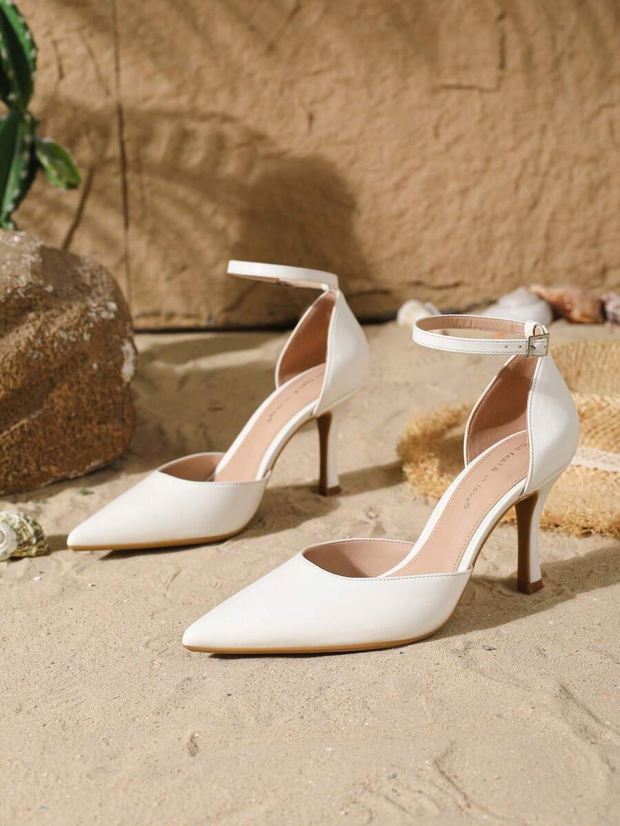 Elegant pointy-toe stiletto high heel pumps with hollow out sides and buckle ankle strap for weddings and evening dresses.