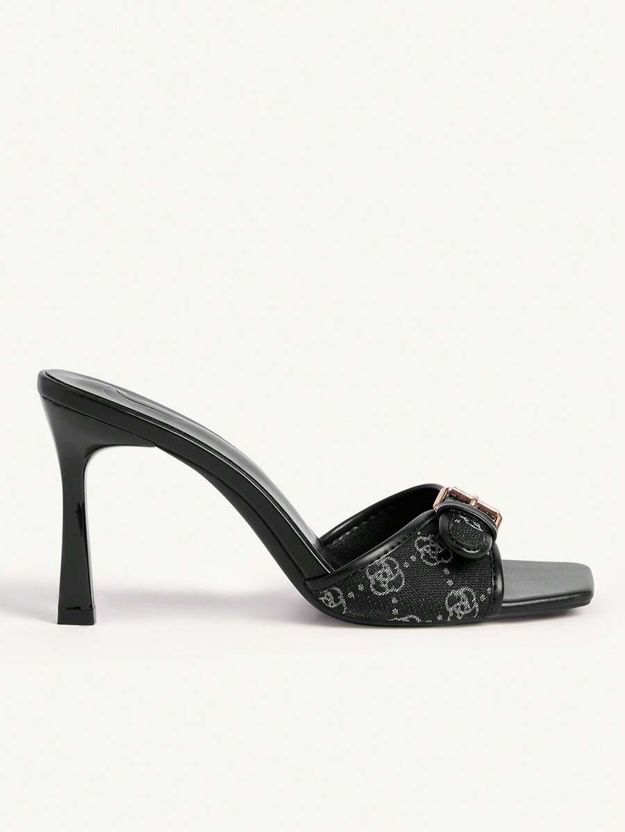 Women's brown open-toe slingback heeled sandals with stiletto heel and buckle strap.