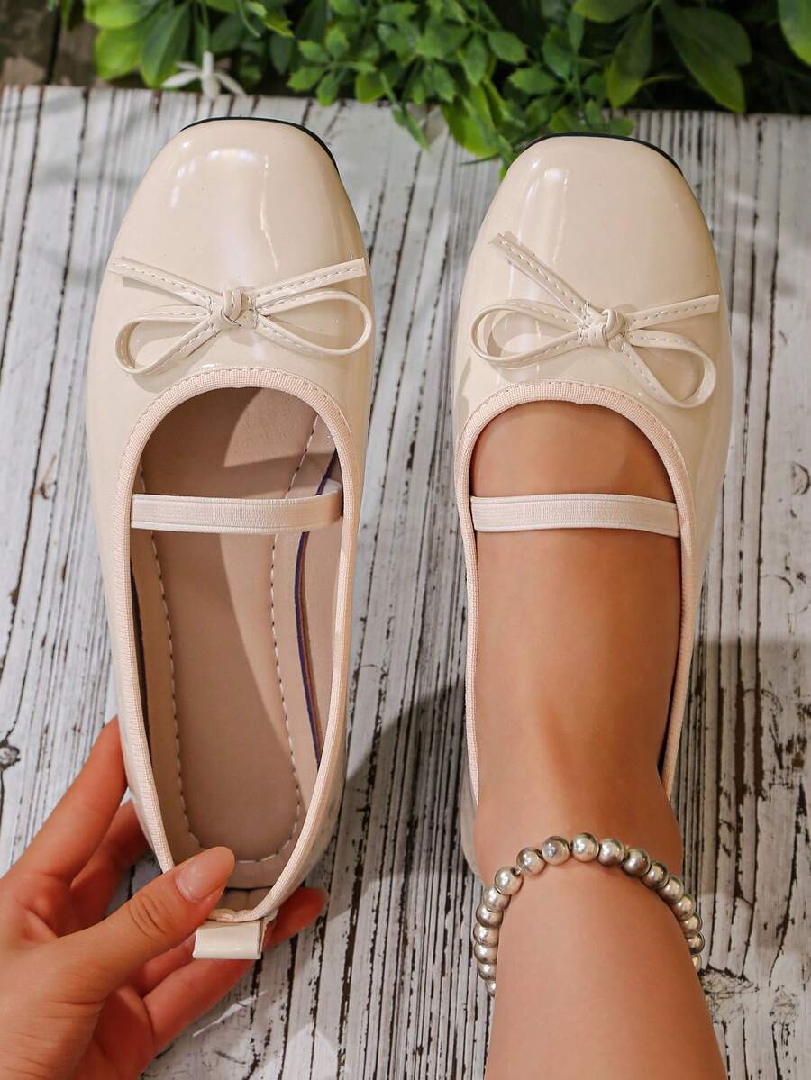 Square toe ballet flat shoes with bow detail and slip-on wide fit design.