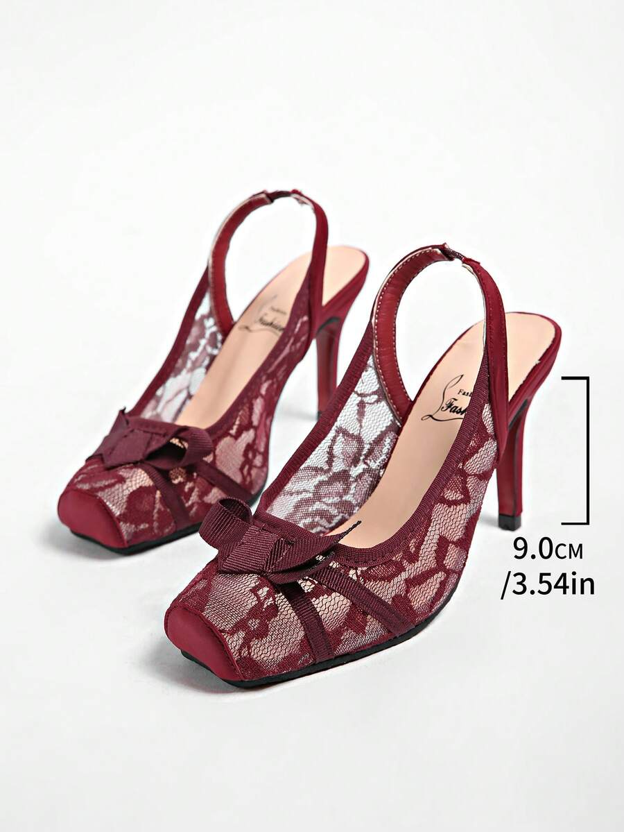 Black lace high heel sandals for women with a big bowknot, closed square toe, and stiletto heel.