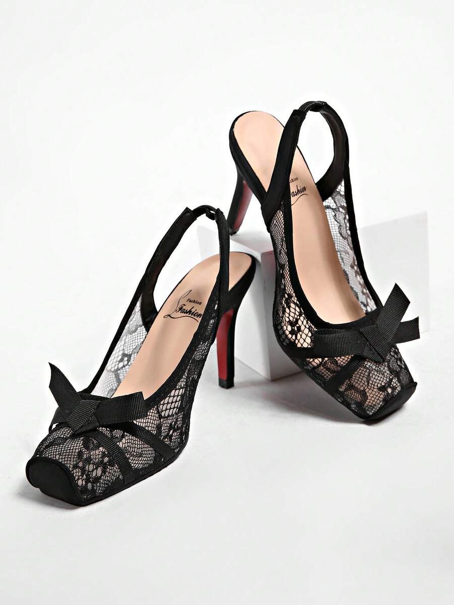 Black lace high heel sandals for women with a big bowknot, closed square toe, and stiletto heel.