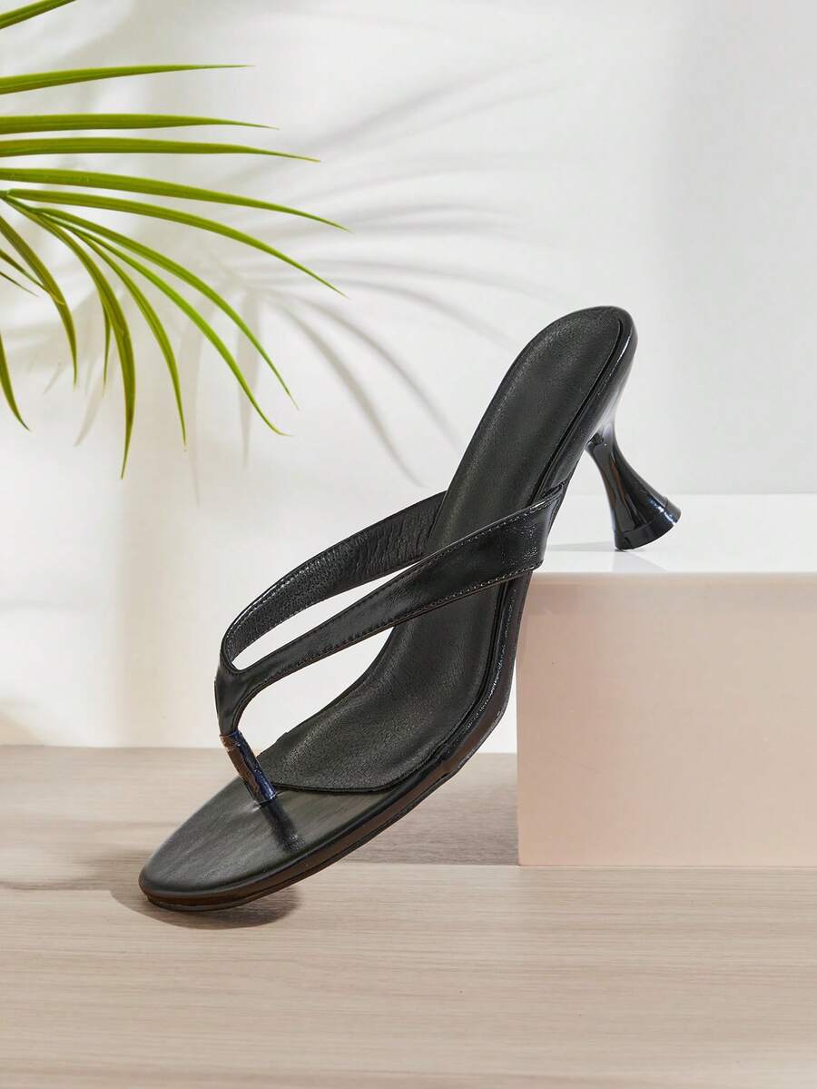 Women's minimalist black PU leather thong heel sandals featuring kitten heels and rhinestone accents