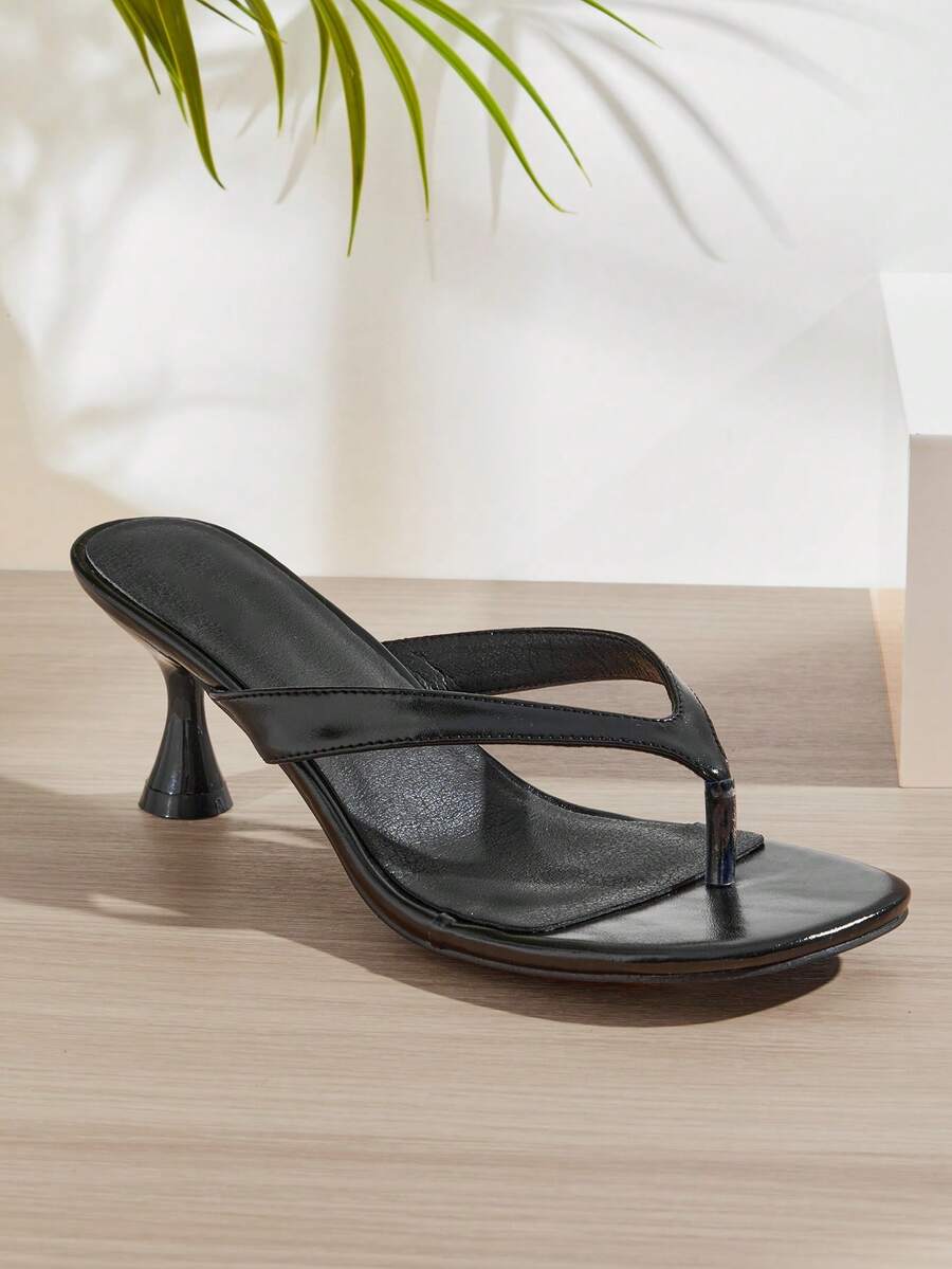 Women's minimalist black PU leather thong heel sandals featuring kitten heels and rhinestone accents