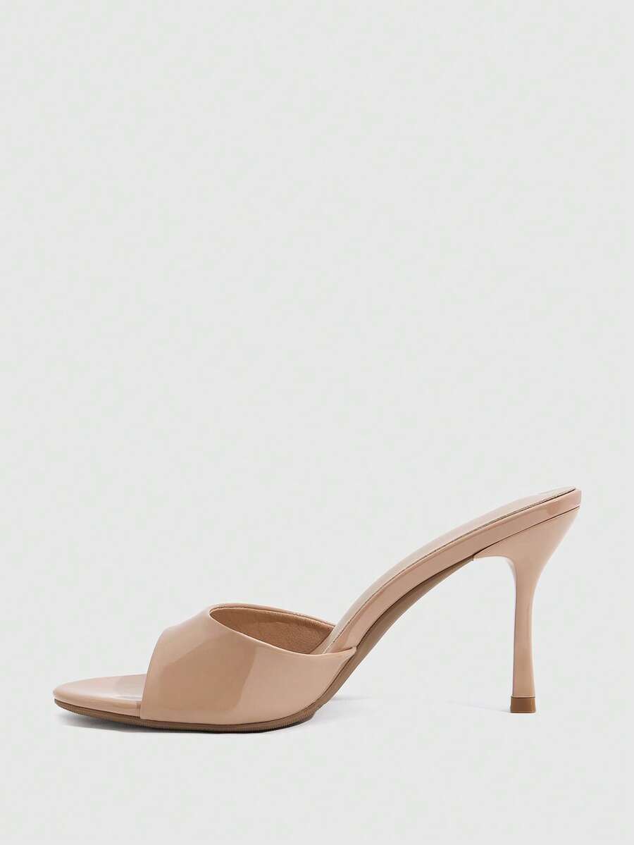 Women's peep toe high-heeled stiletto sandals with slingback strap in light metallic finish.