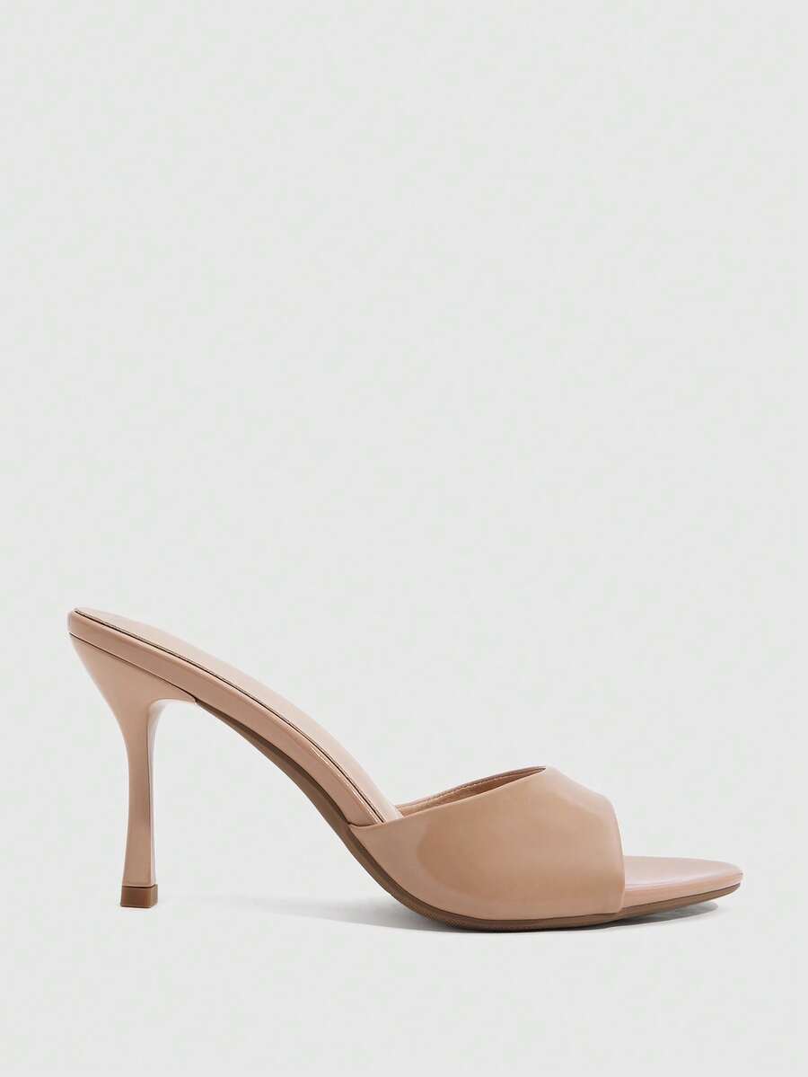 Women's peep toe high-heeled stiletto sandals with slingback strap in light metallic finish.