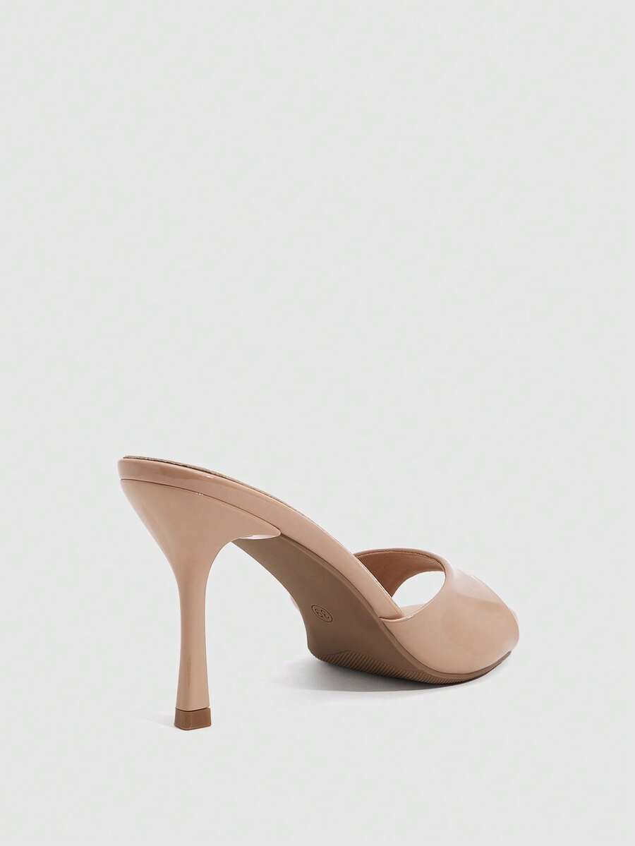 Women's peep toe high-heeled stiletto sandals with slingback strap in light metallic finish.