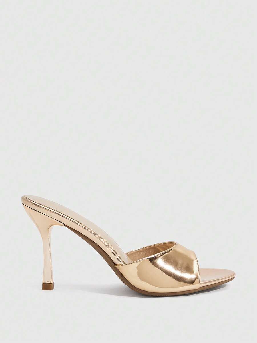 Women's peep toe high-heeled stiletto sandals with slingback strap in light metallic finish.