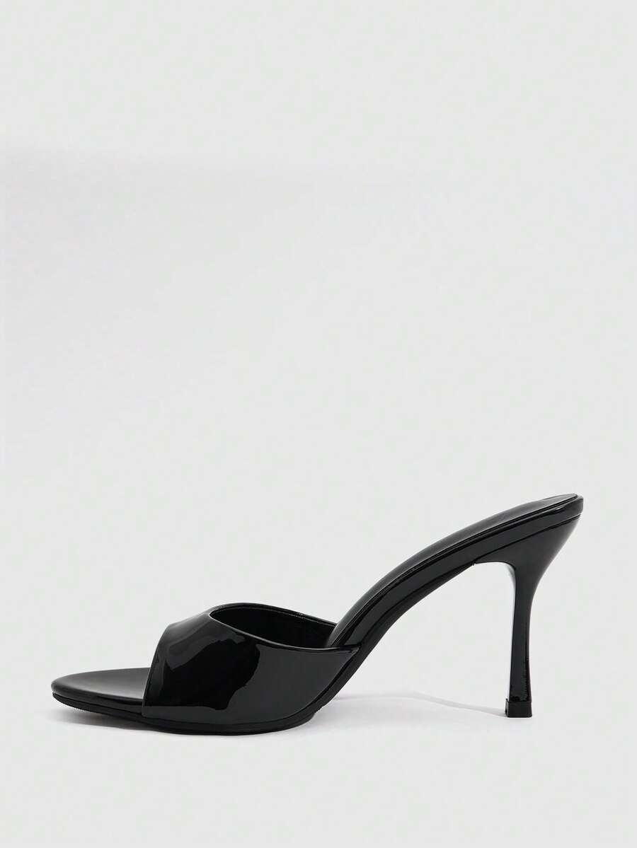 Women's peep toe high-heeled stiletto sandals with slingback strap in light metallic finish.
