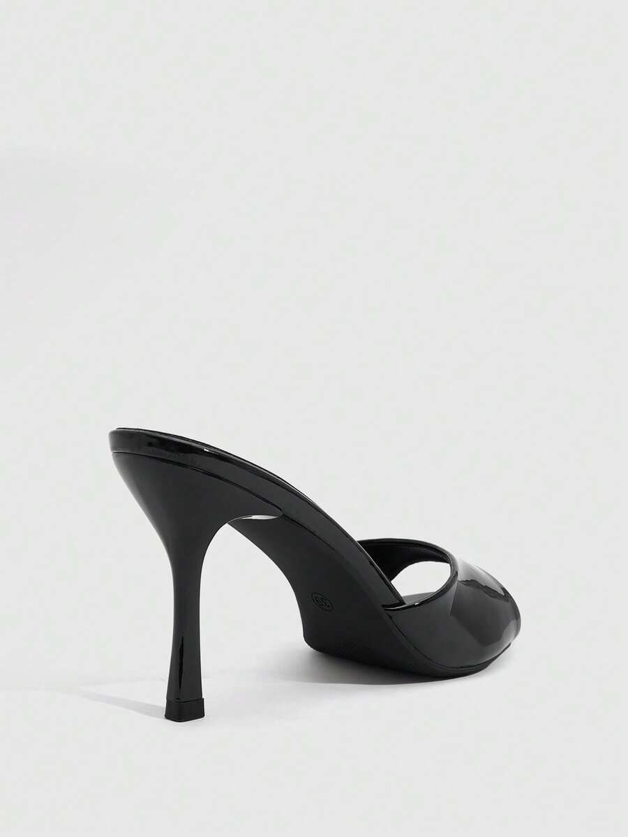 Women's peep toe high-heeled stiletto sandals with slingback strap in light metallic finish.