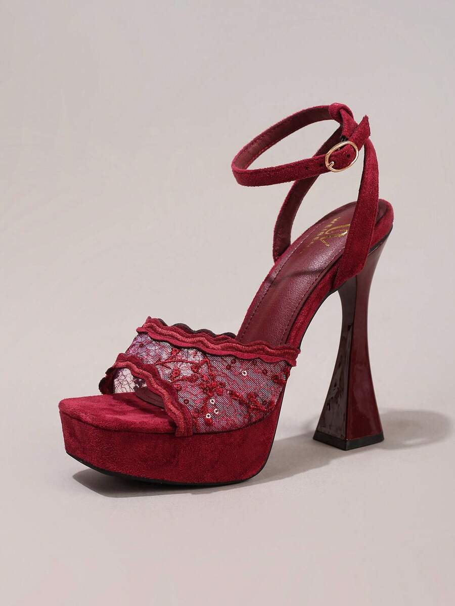 Lace embroidered open toe high heel sandals featuring a chunky square heel, platform wedge, and ankle strap buckle closure.
