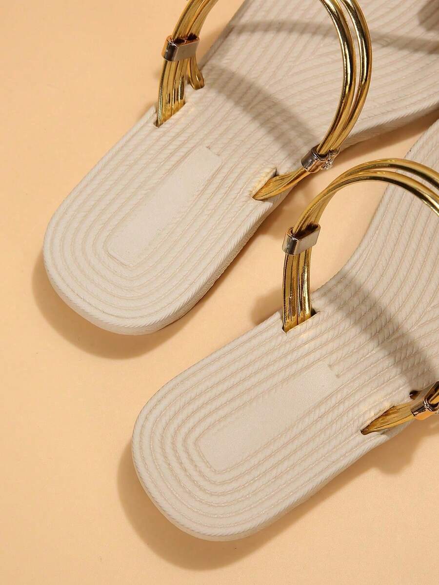 Women's lace-up flat slip-on sandals with round toe and hollow-out PU leather straps for beach and daily wear.