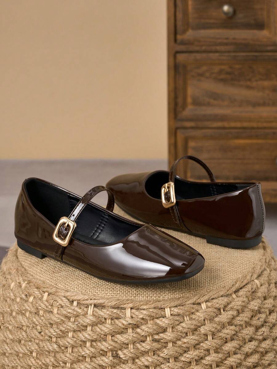 Pair of women's square toe slip-on flat shoes featuring a delicate bow detail and low vamp design.
