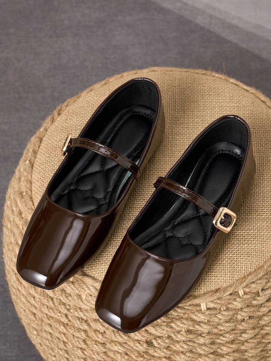 Pair of women's square toe slip-on flat shoes featuring a delicate bow detail and low vamp design.