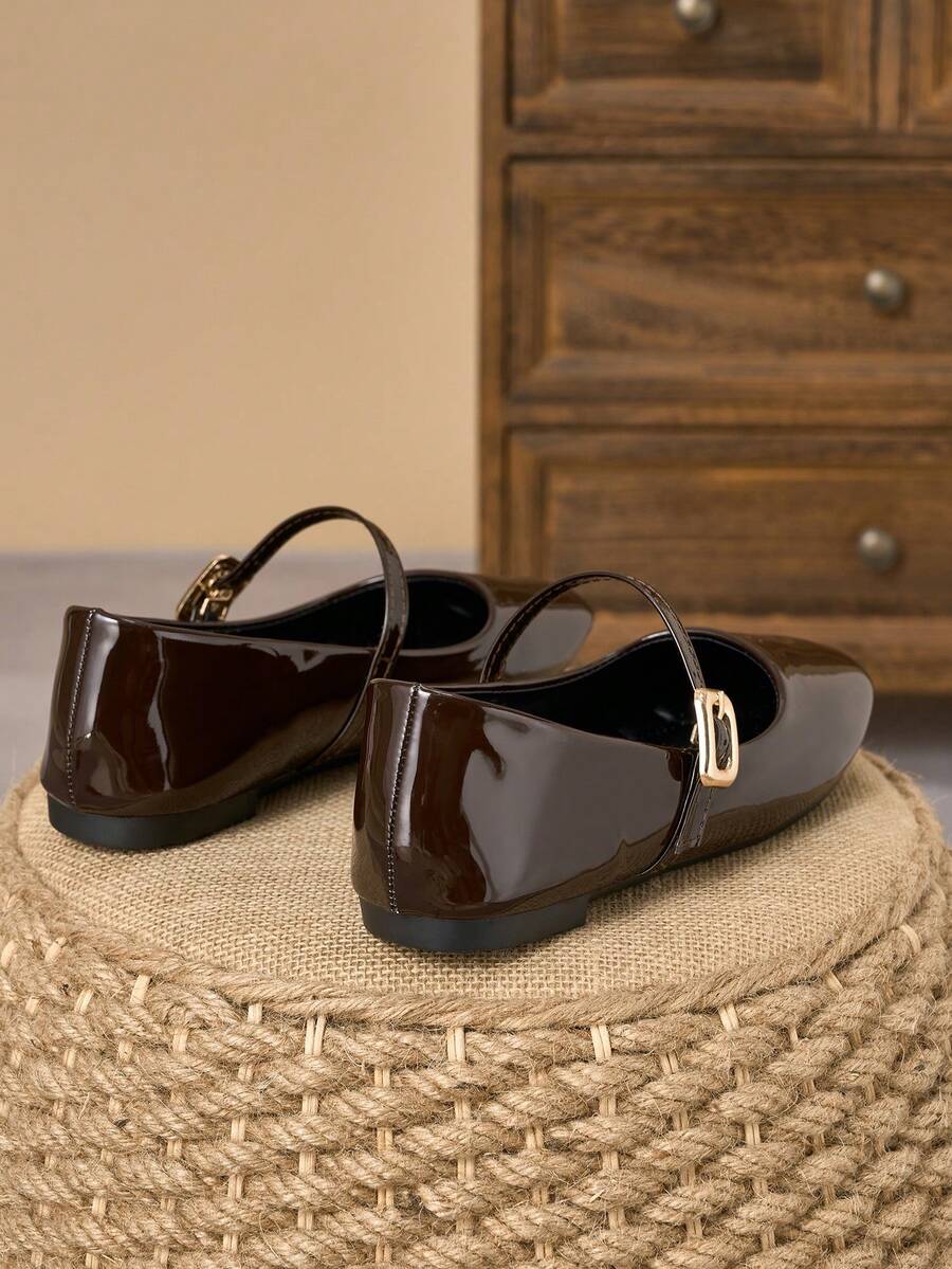 Pair of women's square toe slip-on flat shoes featuring a delicate bow detail and low vamp design.