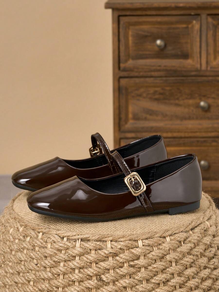 Pair of women's square toe slip-on flat shoes featuring a delicate bow detail and low vamp design.
