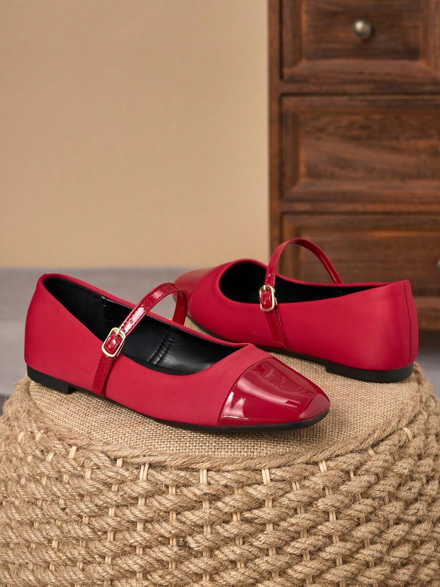 Pair of women's square toe slip-on flat shoes featuring a delicate bow detail and low vamp design.