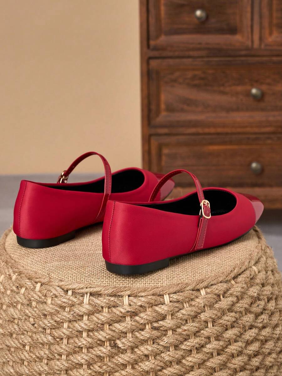 Pair of women's square toe slip-on flat shoes featuring a delicate bow detail and low vamp design.
