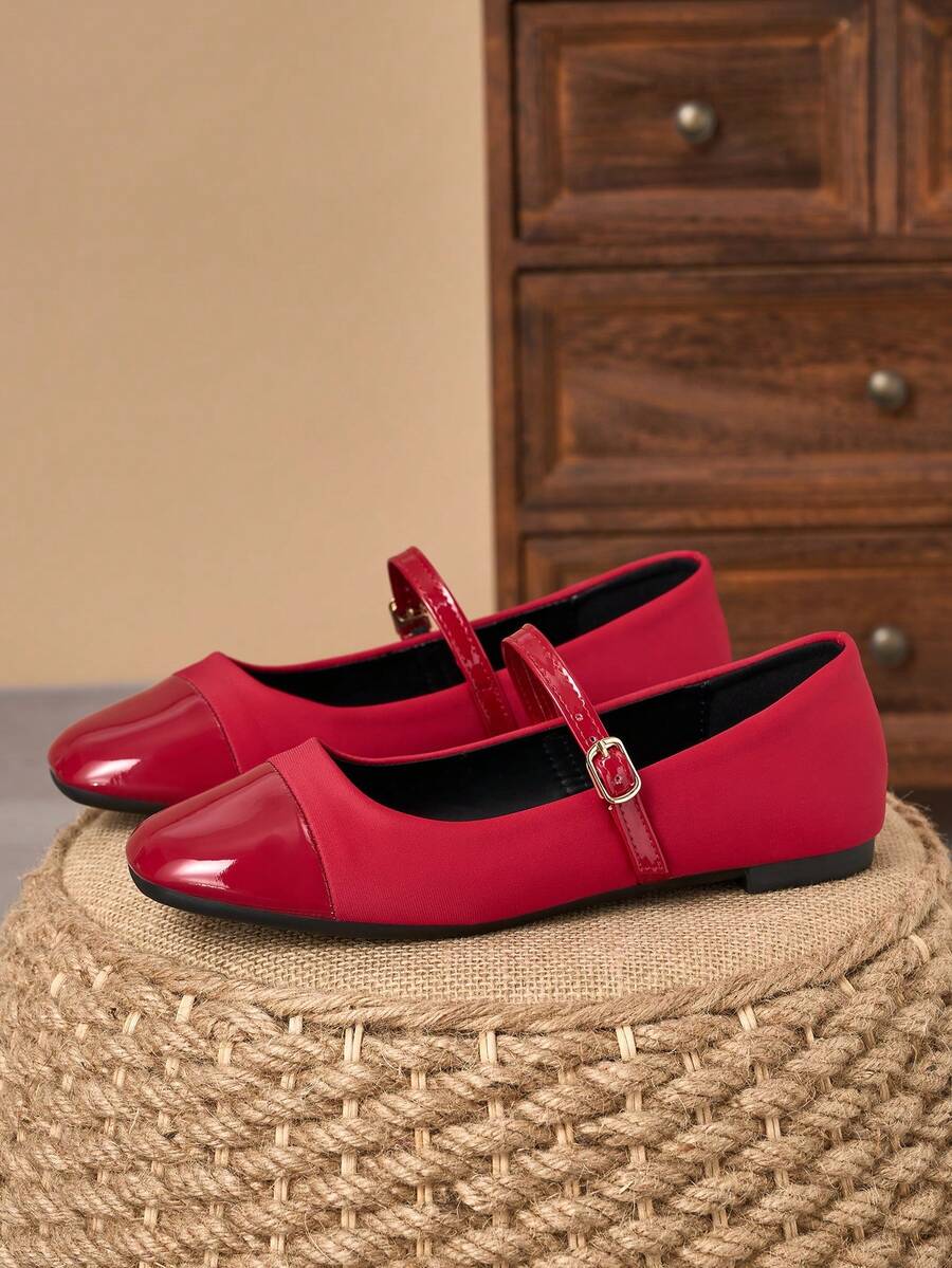Pair of women's square toe slip-on flat shoes featuring a delicate bow detail and low vamp design.