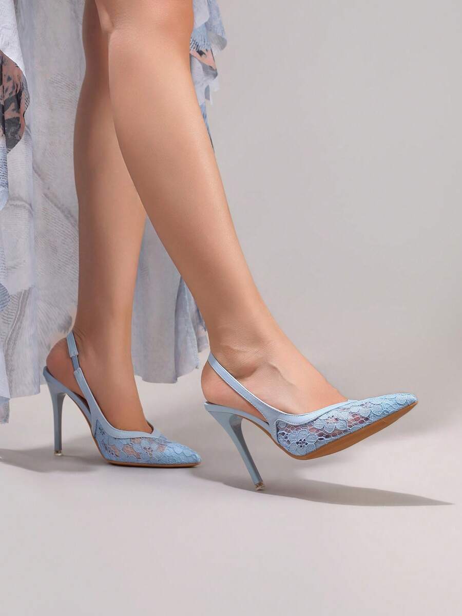 Black lace pointed toe high heel pumps featuring stiletto heels and a decorative bow accent.
