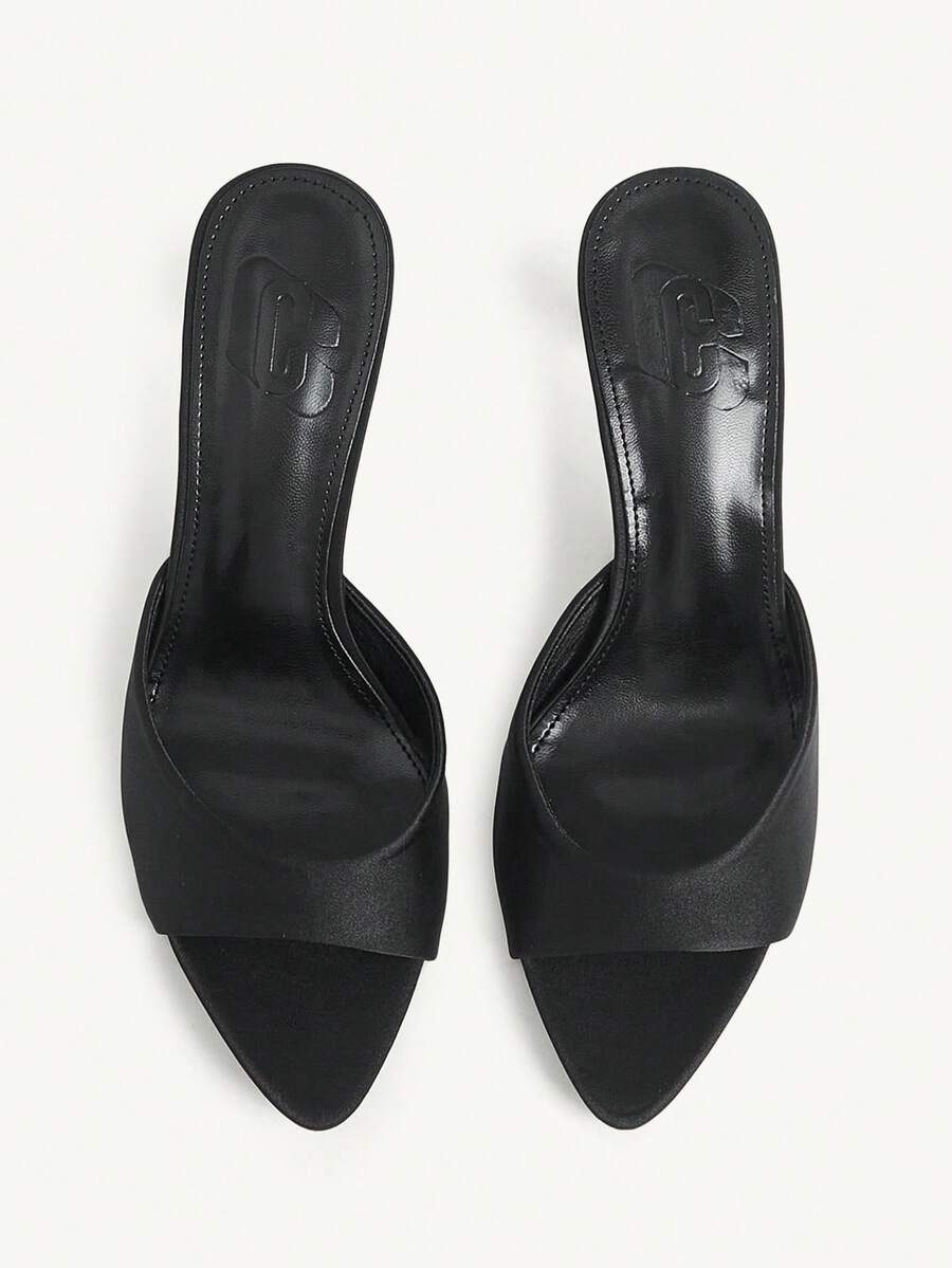 Elegant women's pointed toe heeled sandals with textured pattern and sleek stiletto heel