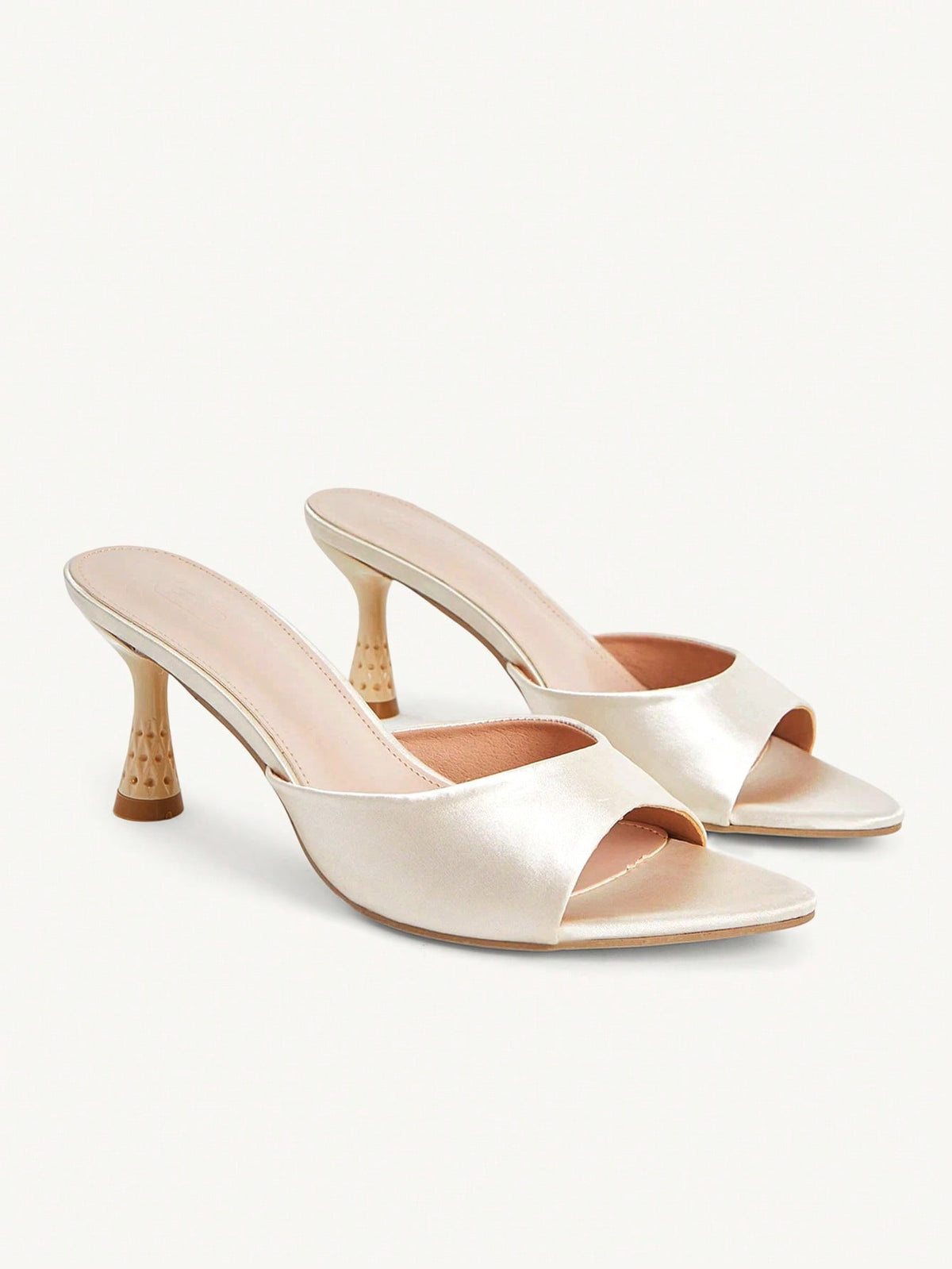 Elegant women's pointed toe heeled sandals with textured pattern and sleek stiletto heel