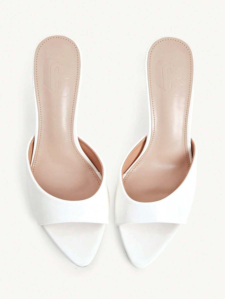 Elegant women's pointed toe heeled sandals with textured pattern and sleek stiletto heel