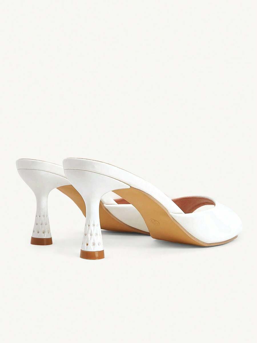 Elegant women's pointed toe heeled sandals with textured pattern and sleek stiletto heel