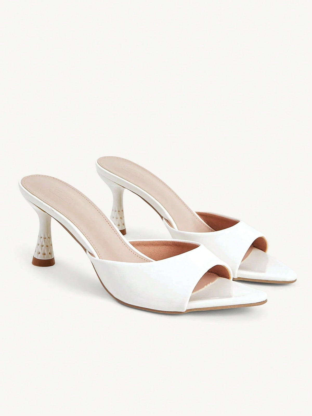 Elegant women's pointed toe heeled sandals with textured pattern and sleek stiletto heel