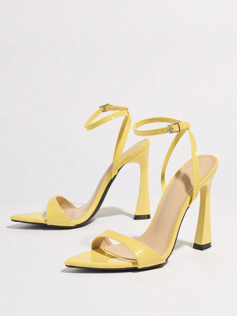 Burgundy open-toe high heels featuring an adjustable ankle strap with buckle closure and high stiletto heel.