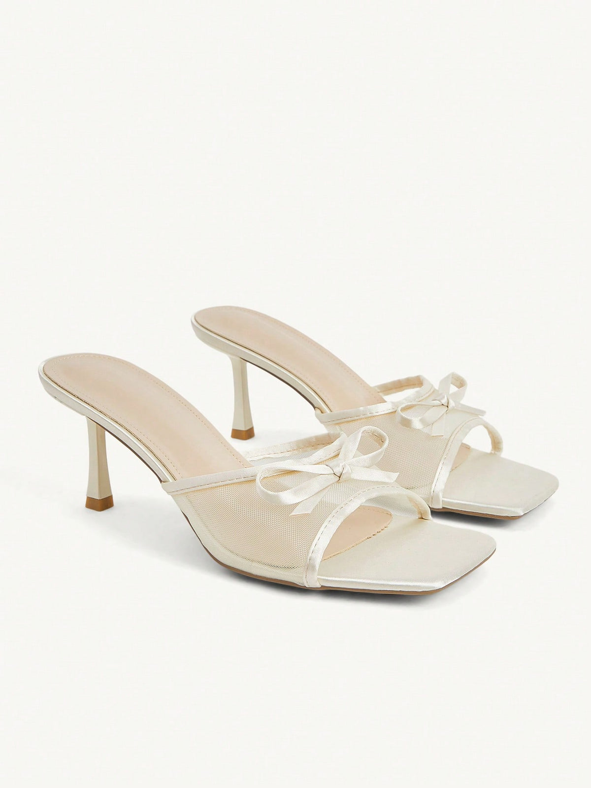 Pair of women's open toe stiletto heeled sandals crafted in satin with a bow accent