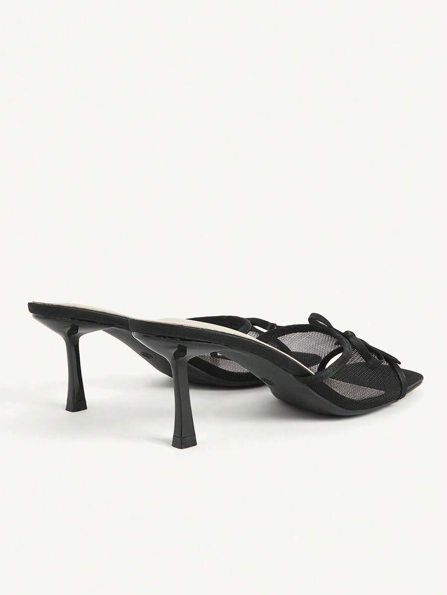 Pair of women's open toe stiletto heeled sandals crafted in satin with a bow accent
