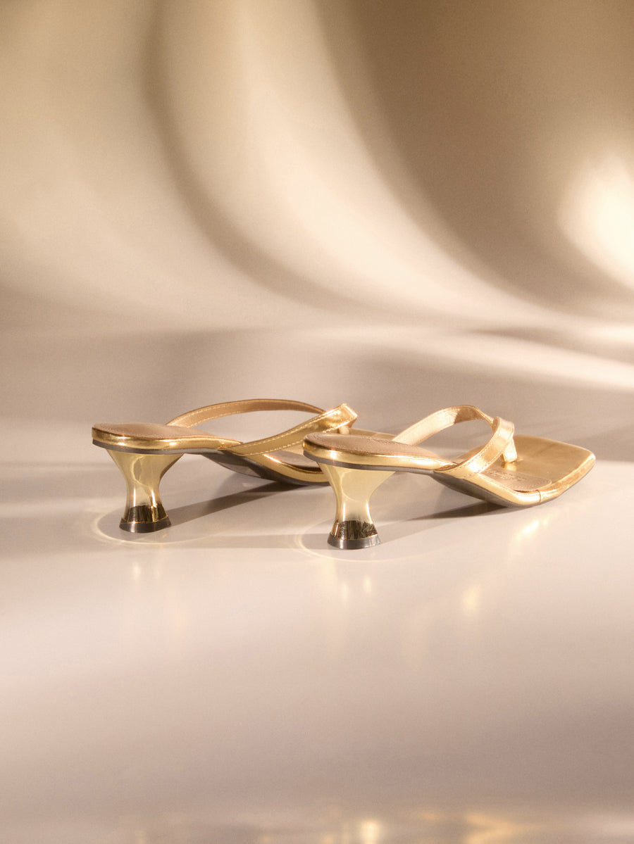 Gold metallic square toe high heel thong sandals for women with mid kitten heel and slip-on design