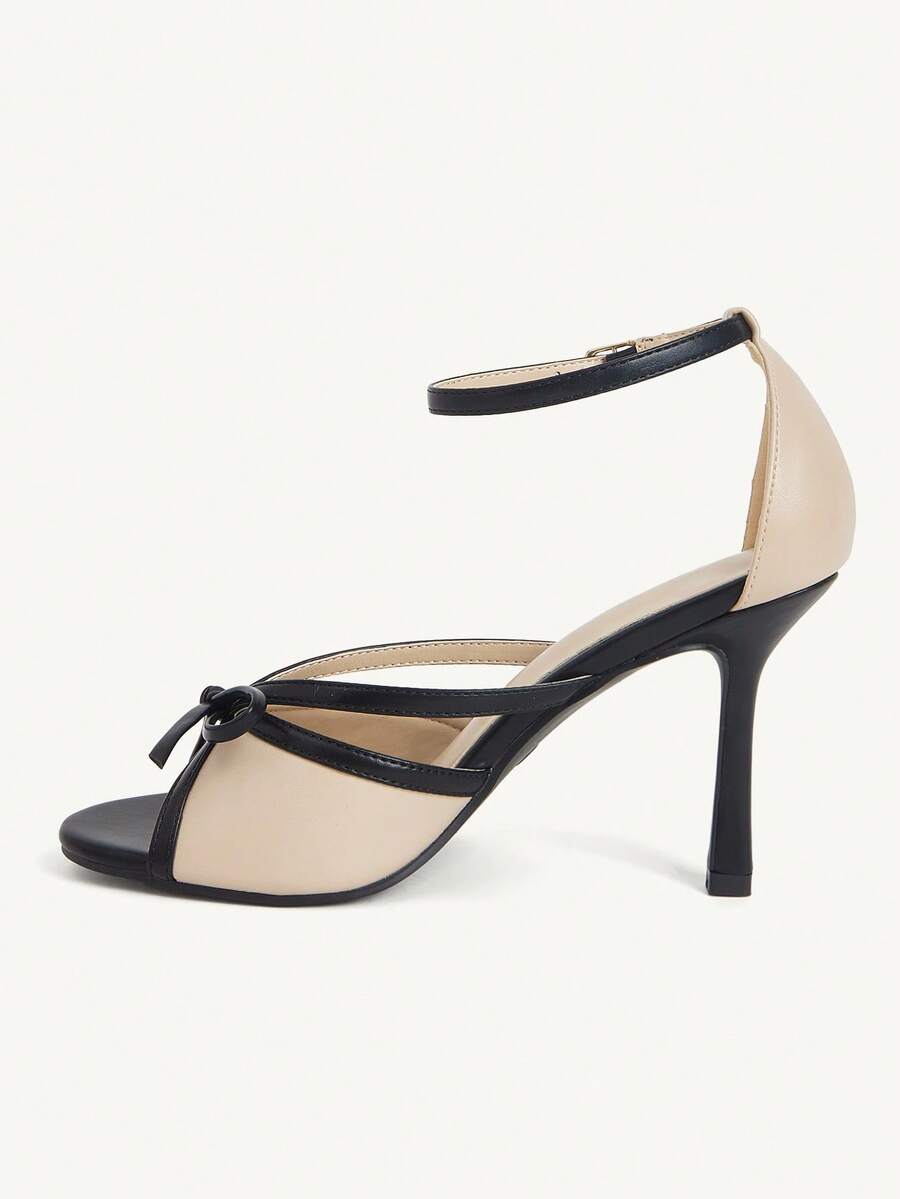 Elegant women's satin high heel sandals with pearl embellishments, stiletto heels, and slingback straps for bridal and wedding wear.