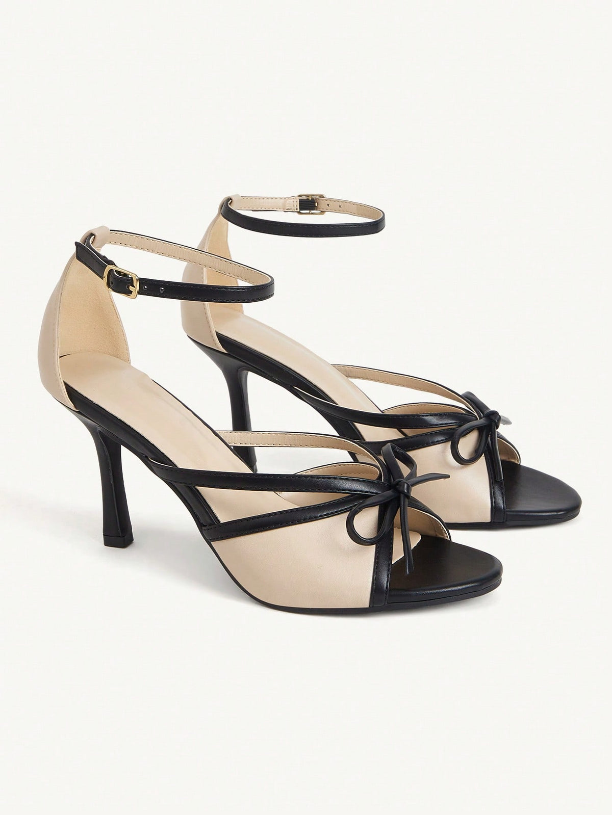 Elegant women's satin high heel sandals with pearl embellishments, stiletto heels, and slingback straps for bridal and wedding wear.