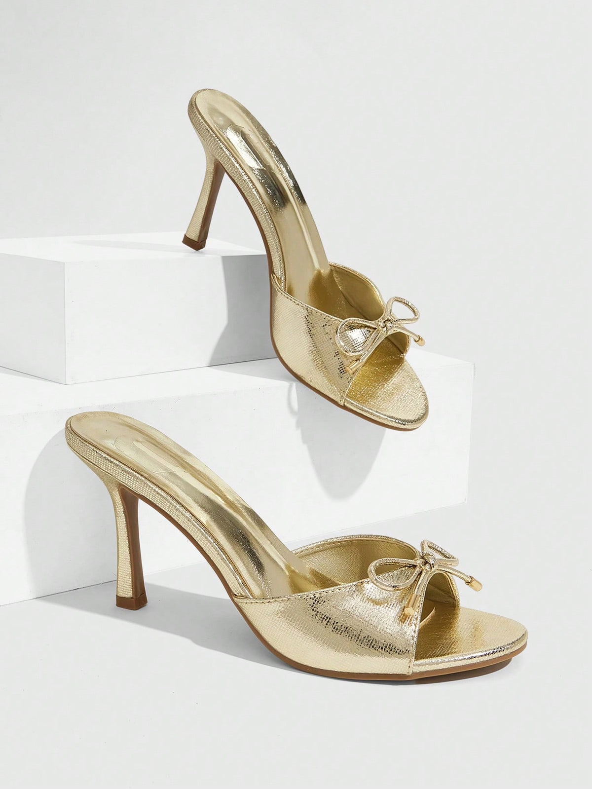 Women's black open-toe stiletto mule high heel sandals with bow detail