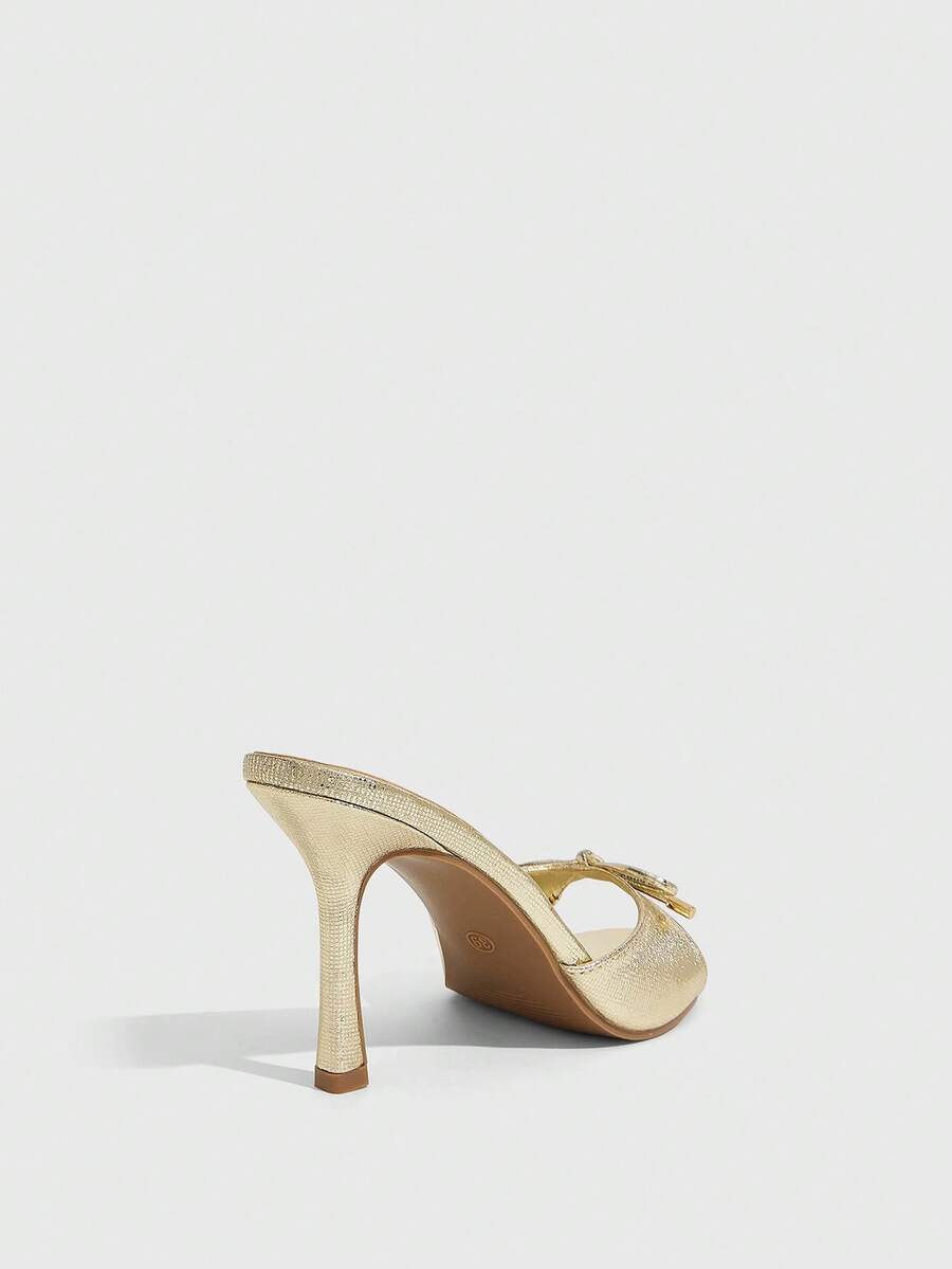 Women's black open-toe stiletto mule high heel sandals with bow detail