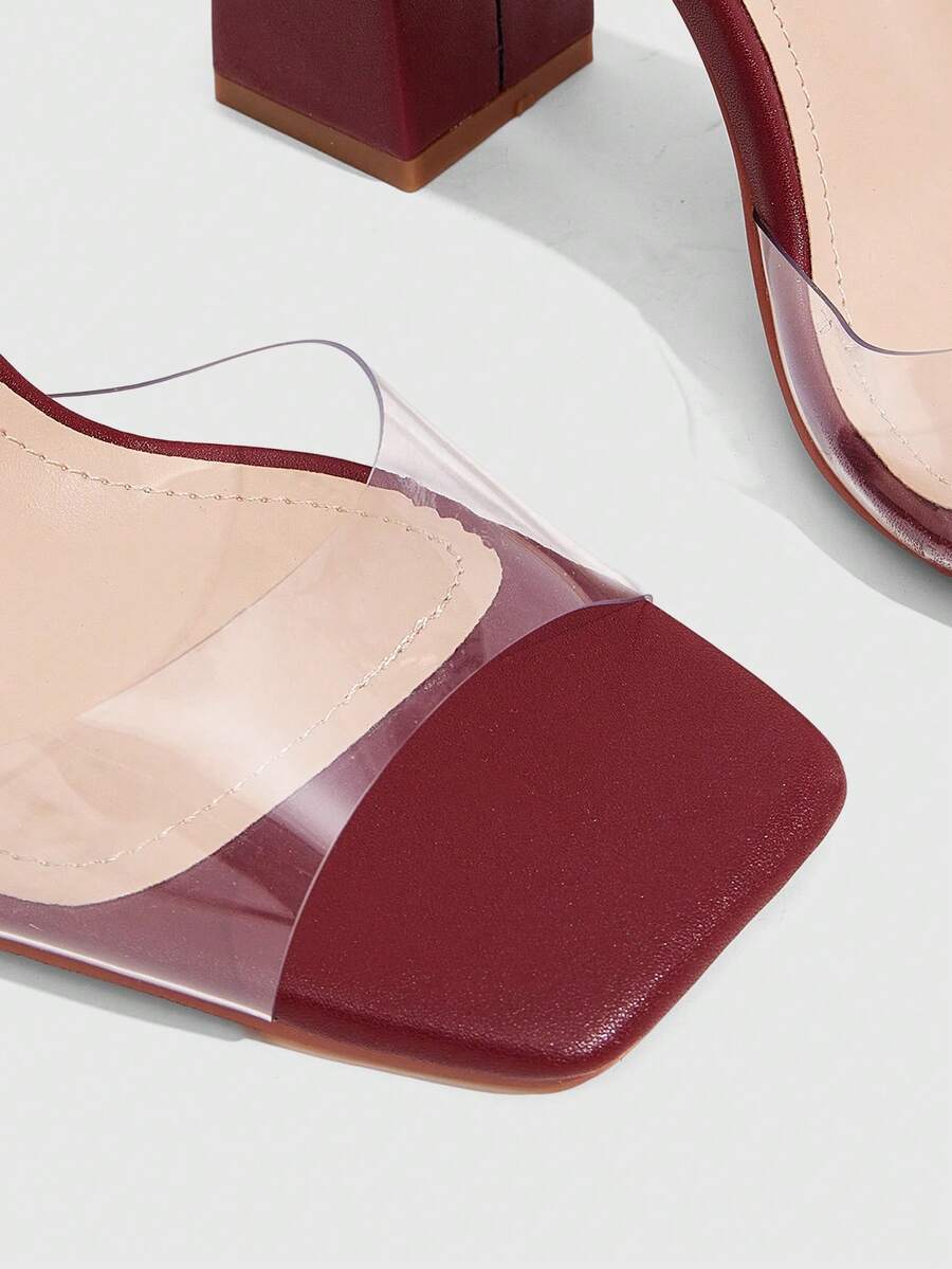 Women's criss-cross lace-up chunky high heel sandals with open square toe and strappy design.