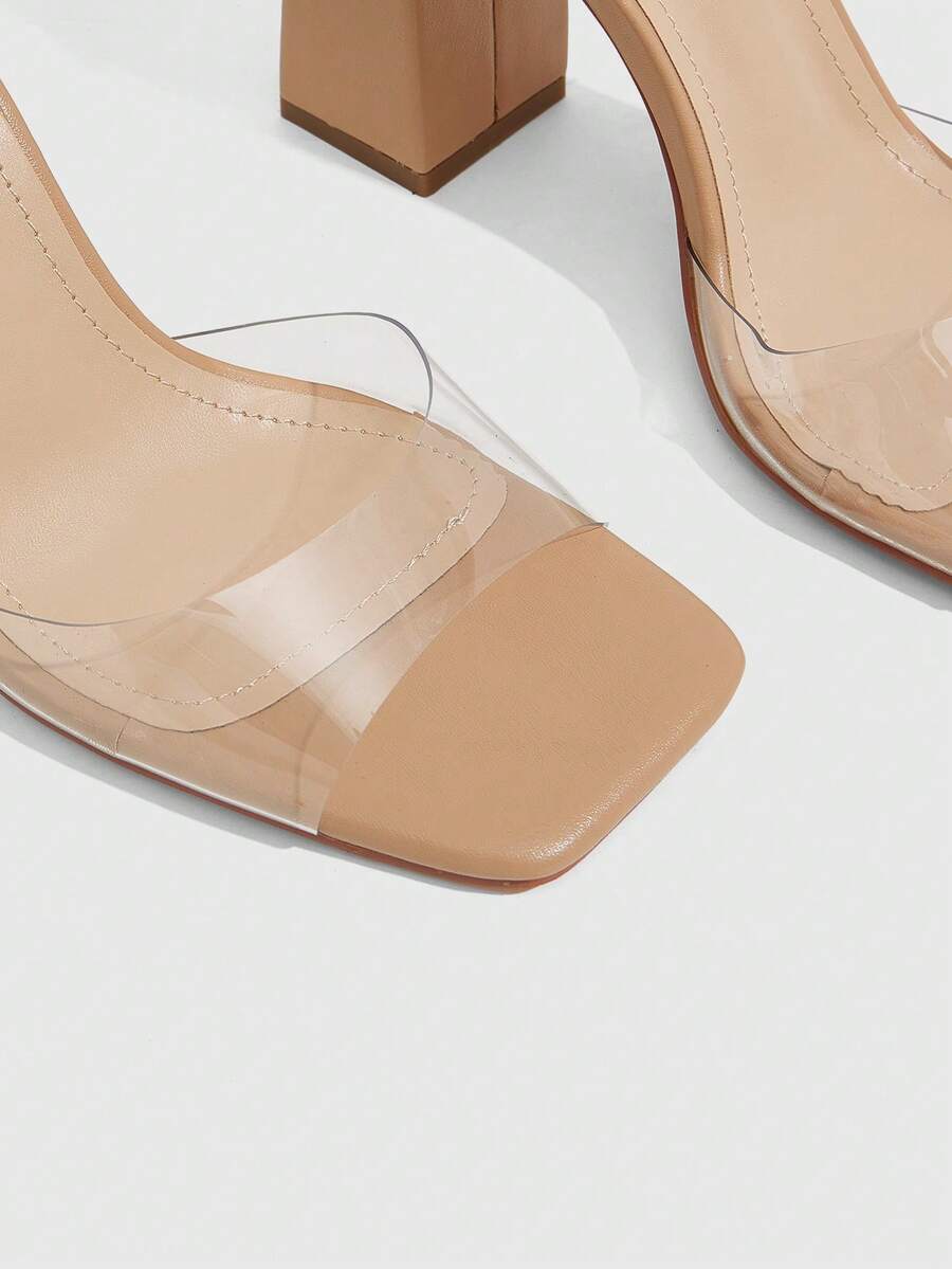 Women's criss-cross lace-up chunky high heel sandals with open square toe and strappy design.