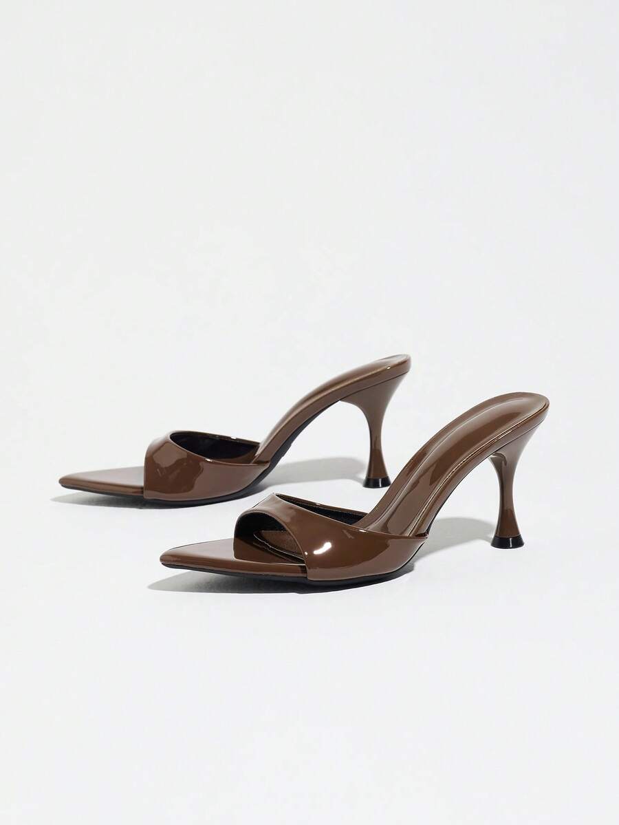 Women's open pointed toe stiletto mule high heel sandals featuring a glossy slip-on design.
