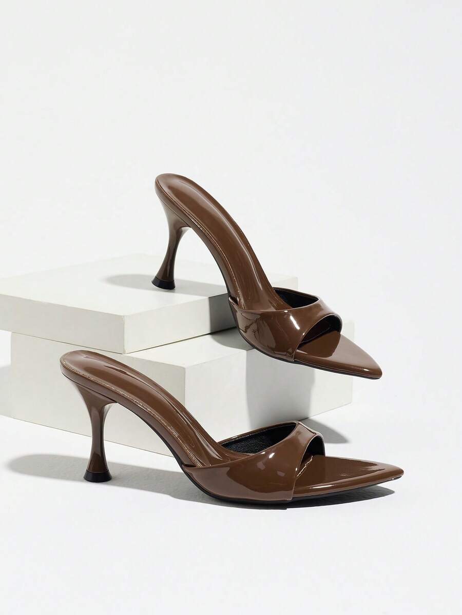 Women's open pointed toe stiletto mule high heel sandals featuring a glossy slip-on design.