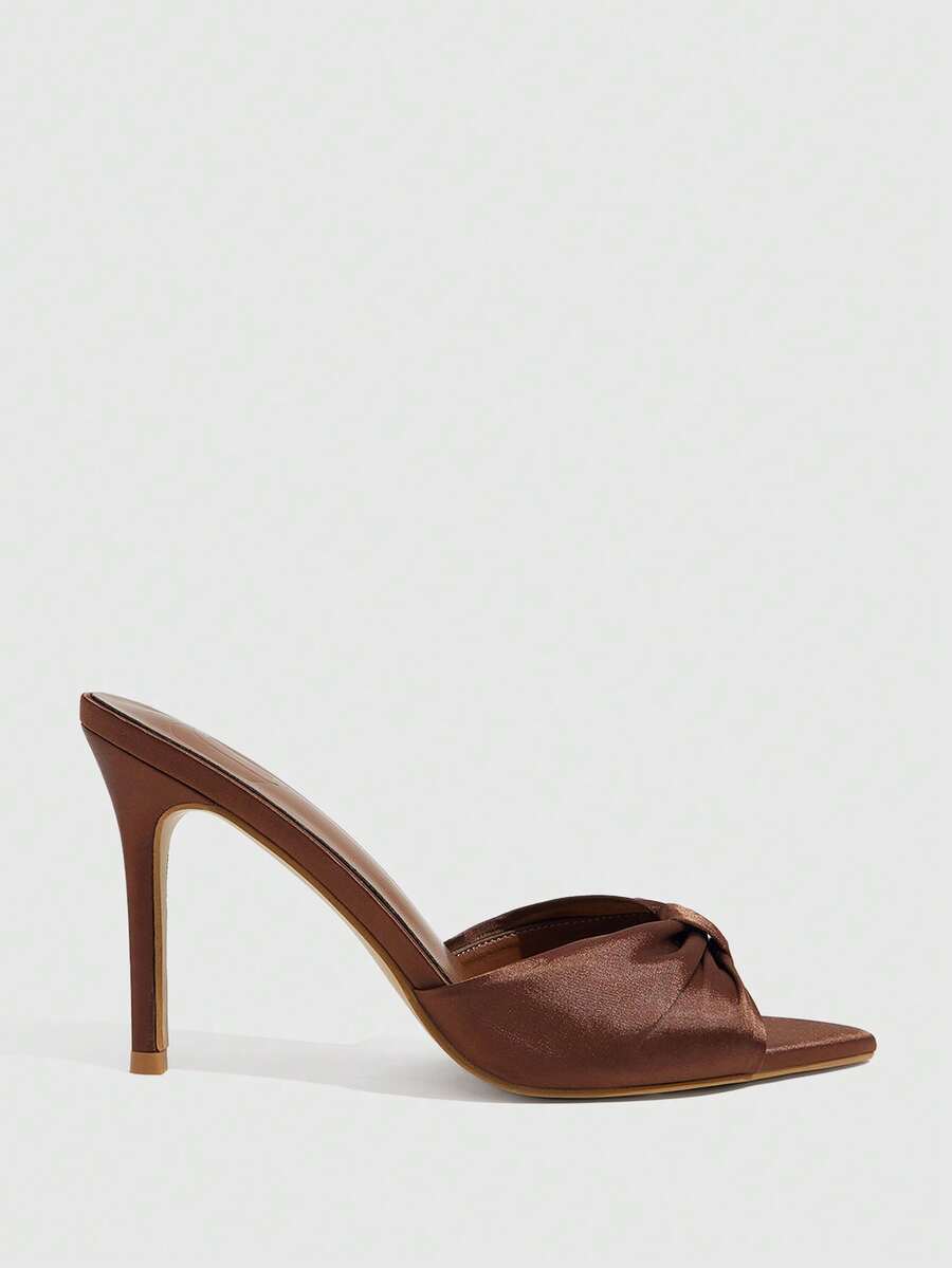 Women's bronze pleated satin stiletto sandals with an open toe design and adjustable buckle slingback strap.