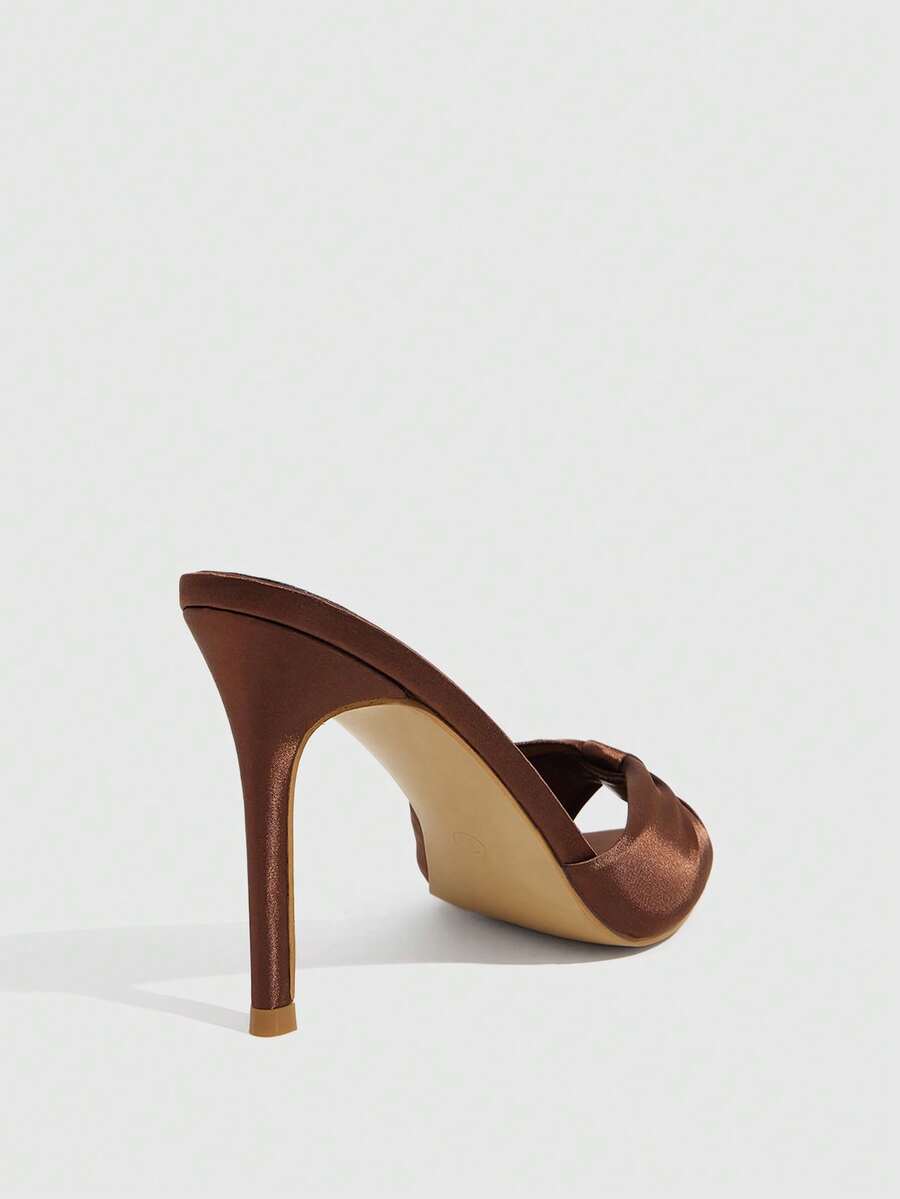 Women's bronze pleated satin stiletto sandals with an open toe design and adjustable buckle slingback strap.