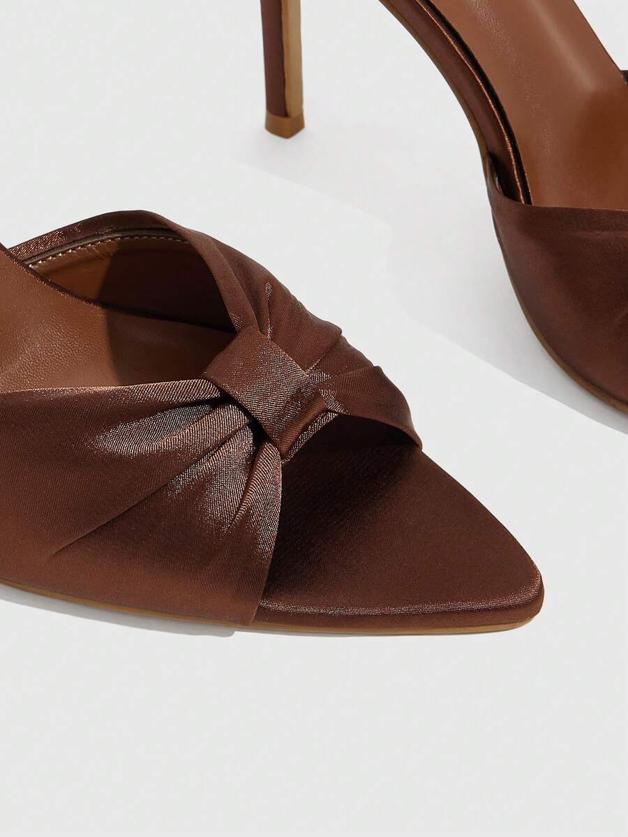 Women's bronze pleated satin stiletto sandals with an open toe design and adjustable buckle slingback strap.