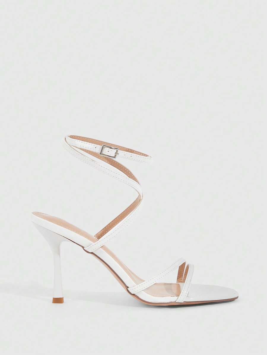 Women's square toe stiletto high heeled sandals with ankle strap buckle in a sleek faux leather finish.