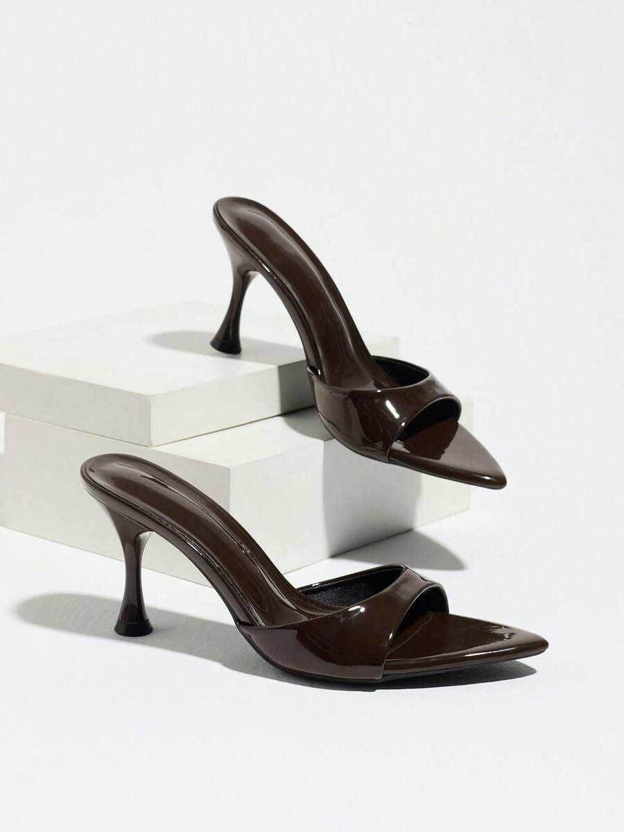 Women's open pointed toe stiletto mule high heel sandals featuring a glossy slip-on design.